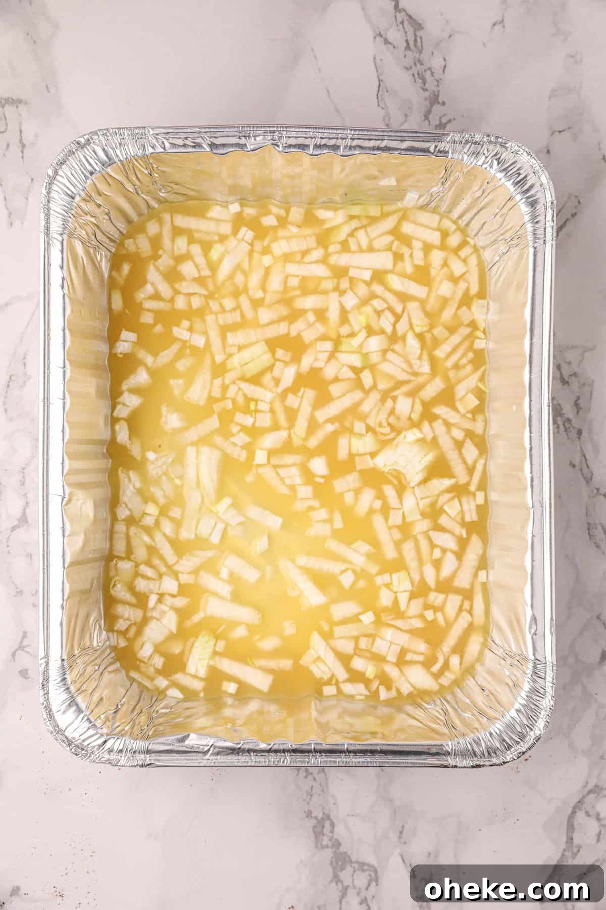 Juice, Garlic, and Onion Bath in Tin for Smoked Pork Carnitas