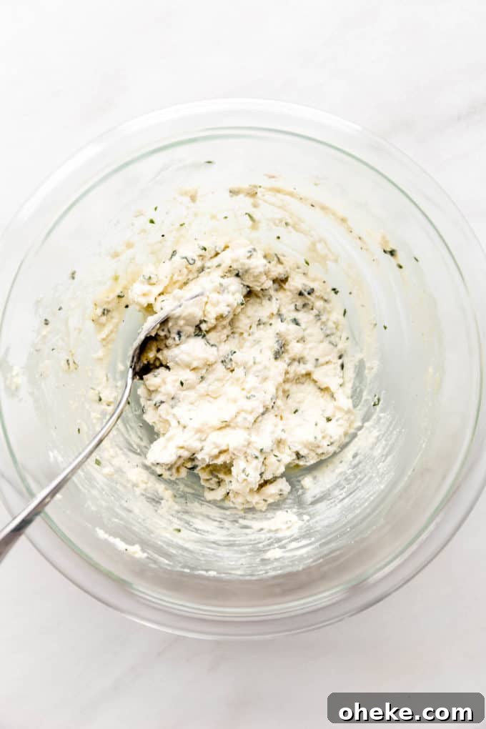 Ricotta-Stuffed Zucchini Involtini with Parmesan and Herbs 6 Mixed up ricotta and herbs in a mixing bowl