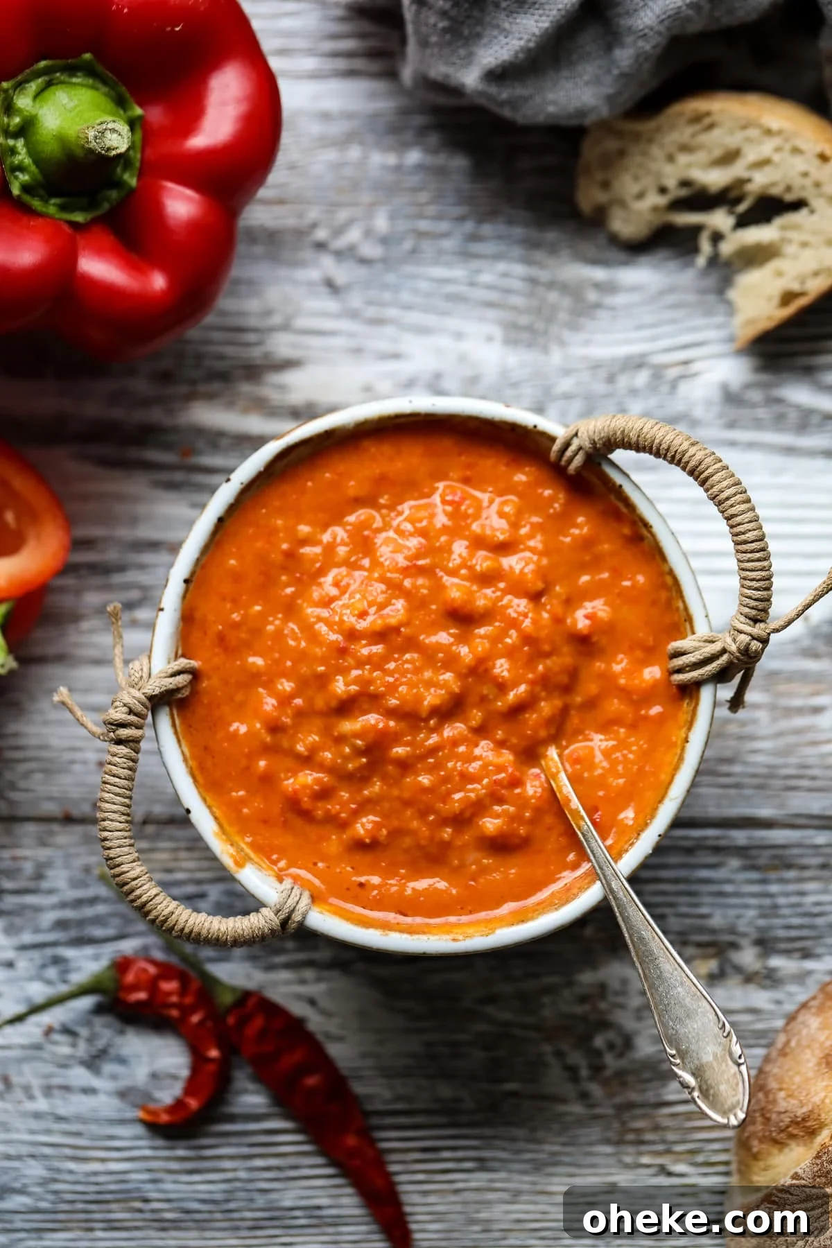Mojo Rojo (Canarian Red Sauce): Authentic Recipe & Uses 2 Mojo rojo in a bowl with a spoon.