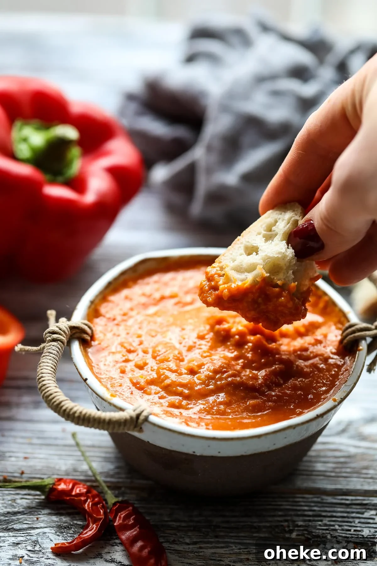 Mojo Rojo (Canarian Red Sauce): Authentic Recipe & Uses 4 Dipping bread in mojo picon.