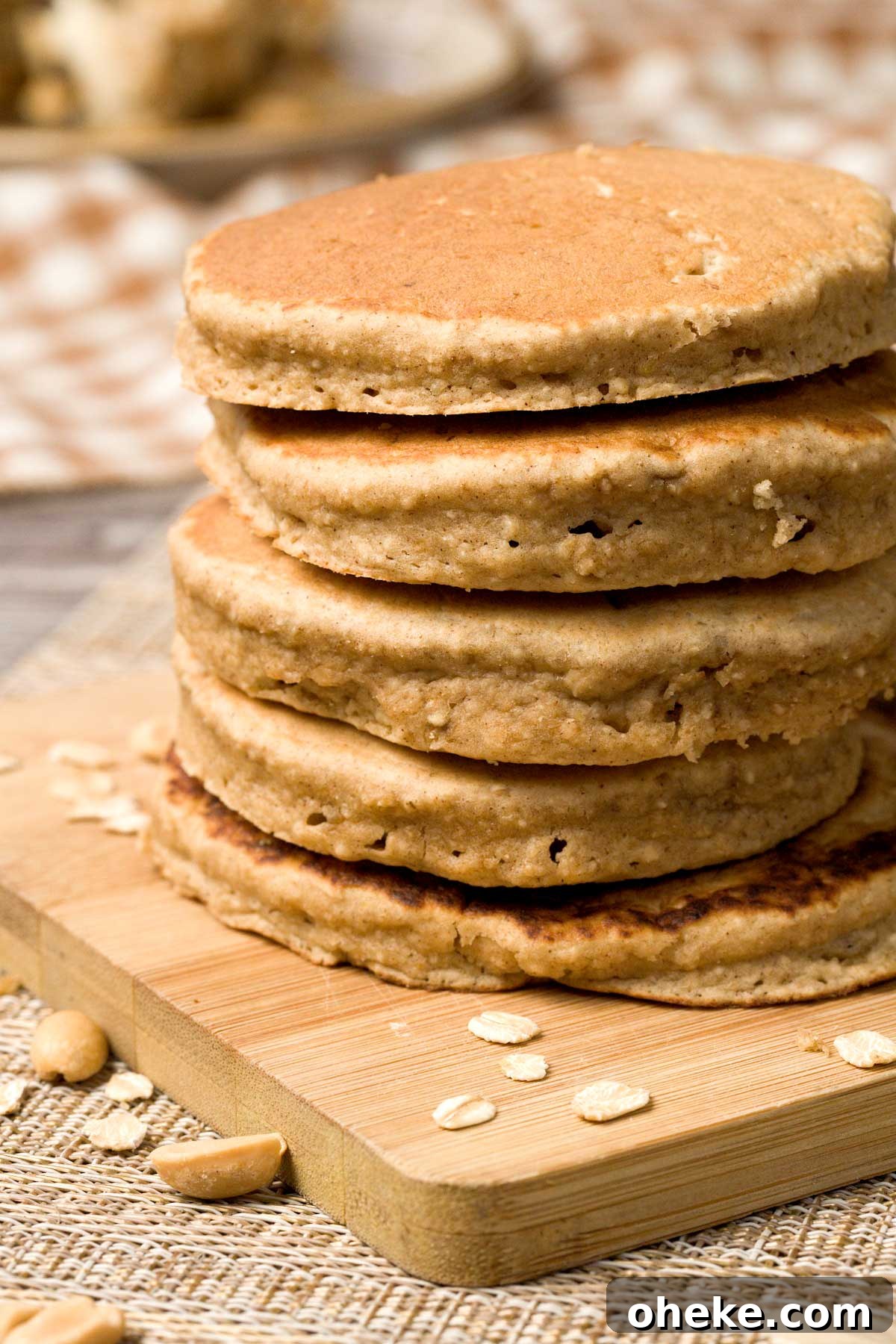 Peanut Butter Banana Protein Pancakes with Cottage Cheese Filling 11 Stack of peanut butter banana pancakes on a plate.
