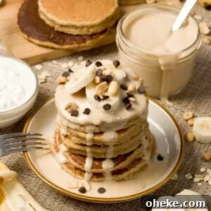 Peanut Butter Banana Protein Pancakes with Cottage Cheese Filling 13 Stack of peanut butter banana pancakes on a plate.