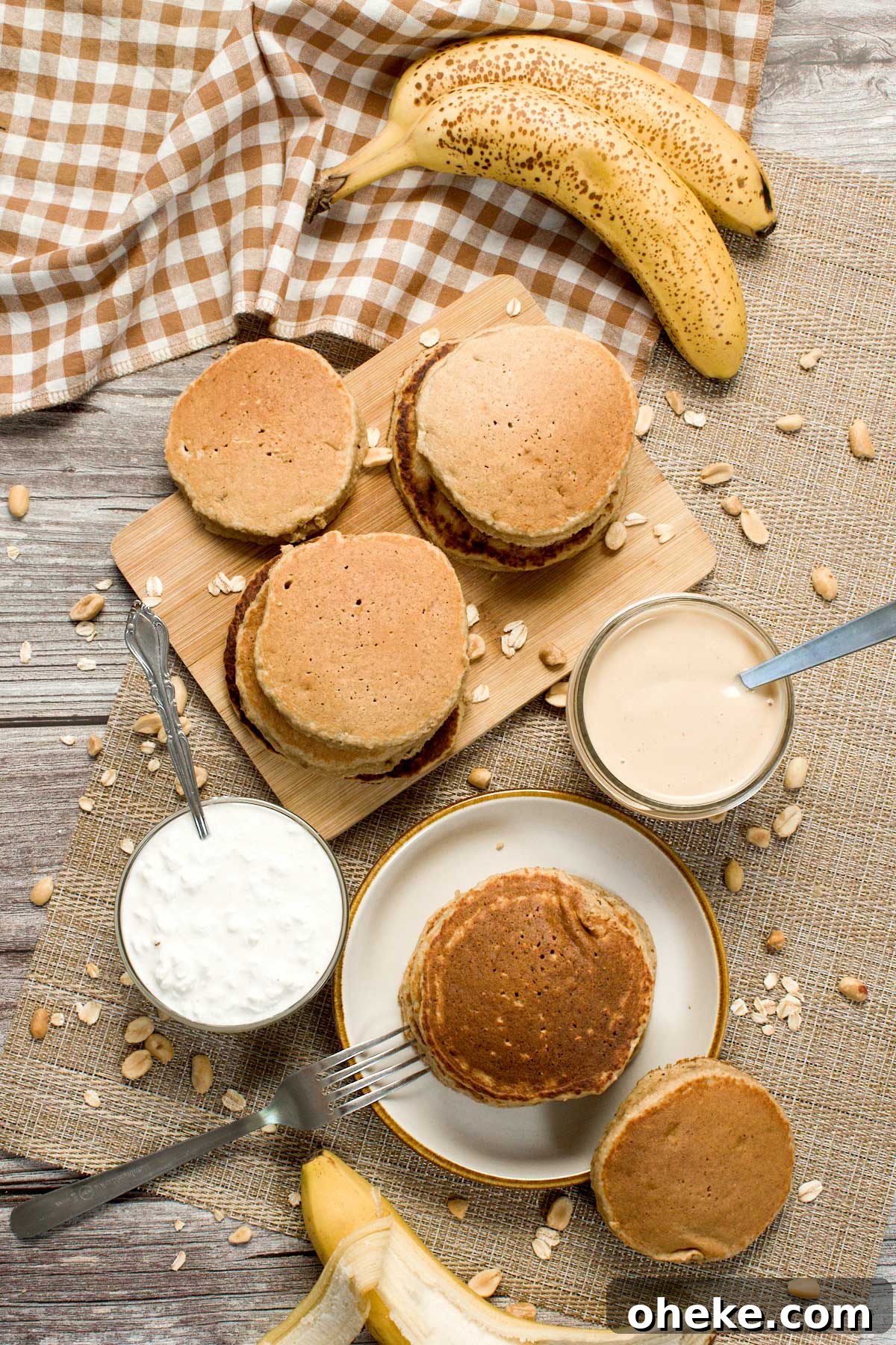 Peanut Butter Banana Protein Pancakes with Cottage Cheese Filling 3 Stack of peanut butter banana pancakes on a plate.