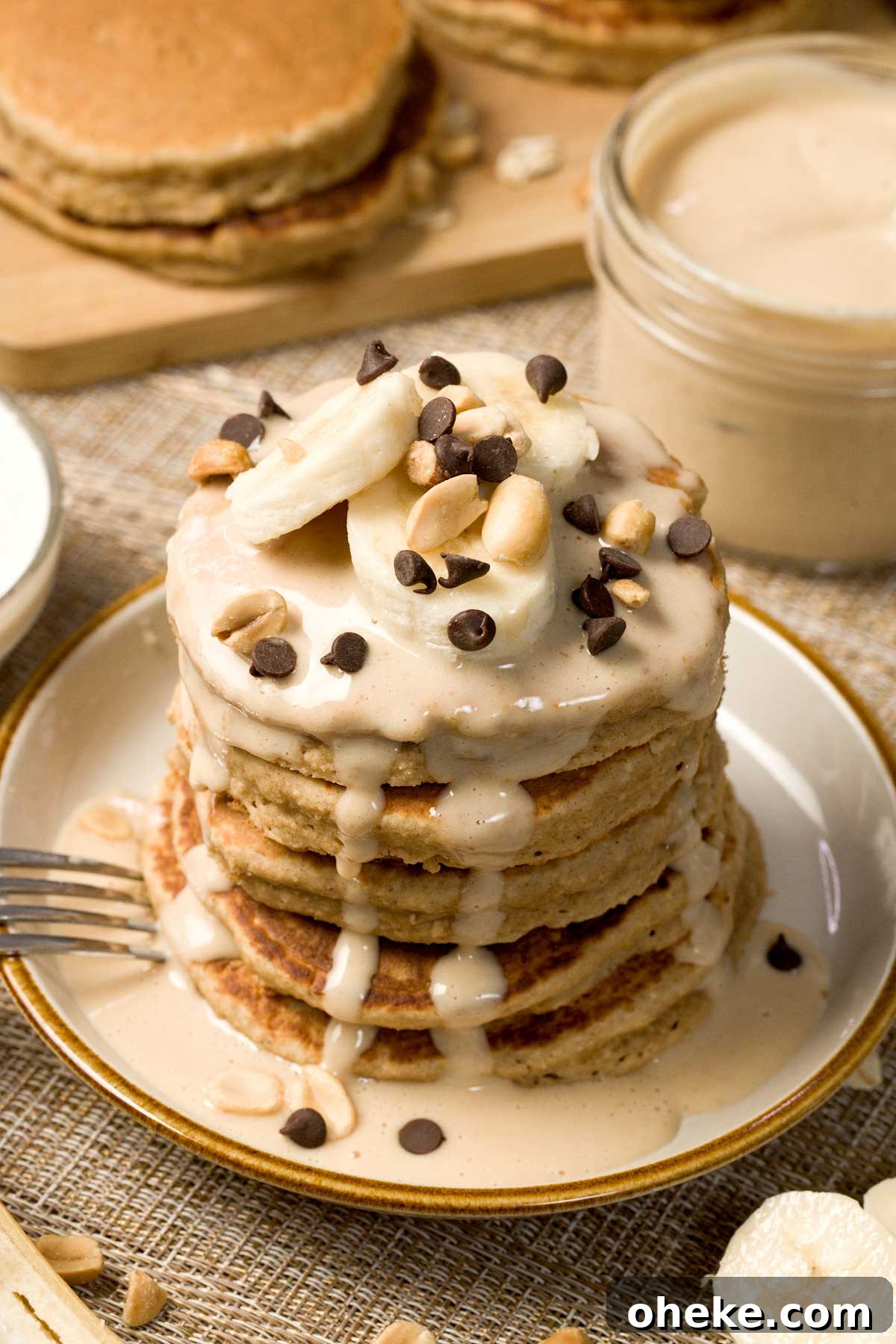 Peanut Butter Banana Protein Pancakes with Cottage Cheese Filling 4 Stack of peanut butter banana pancakes on a plate.