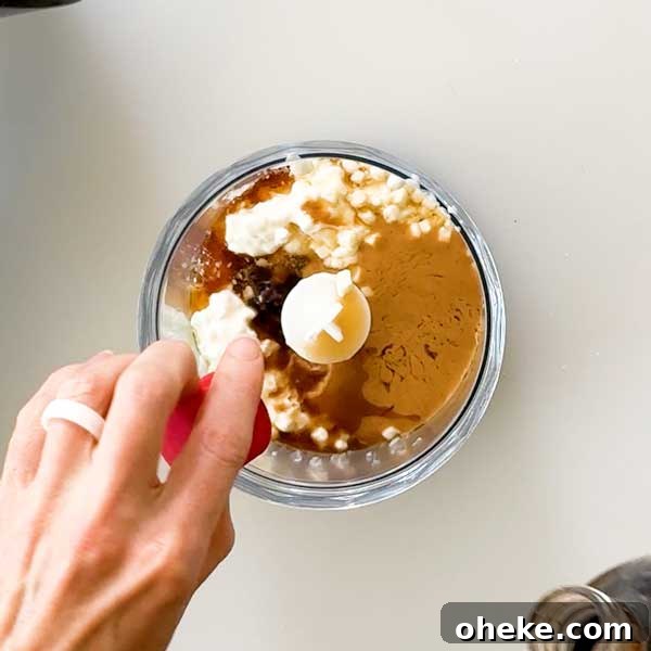 Peanut Butter Banana Protein Pancakes with Cottage Cheese Filling 9 Adding peanut butter sauce ingredients to a chopper cup.