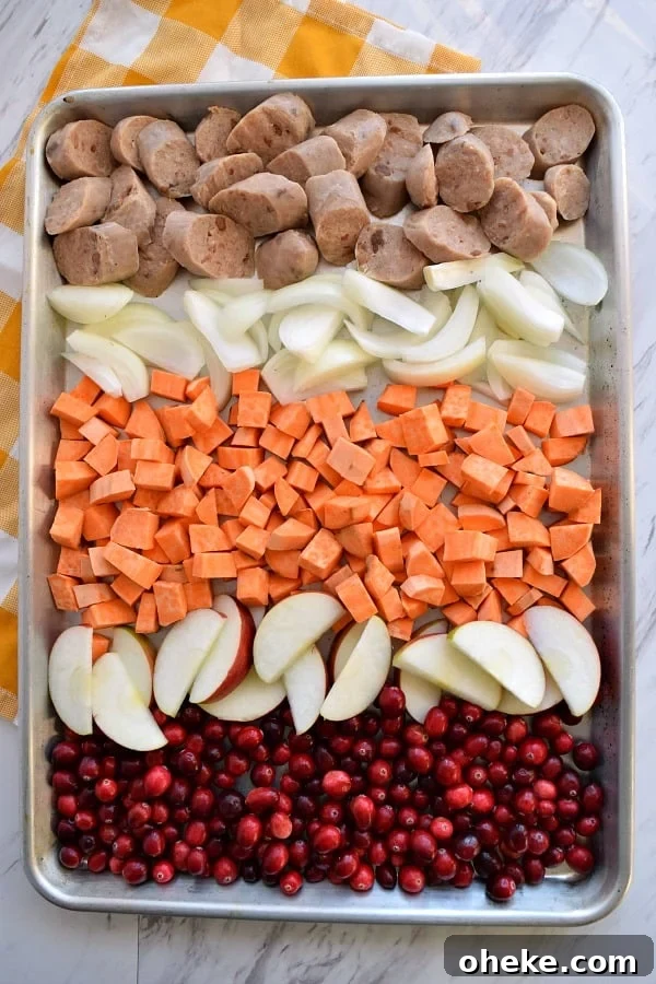 top view of colorful uncooked Sheet Pan Cranberry Chicken Sausage