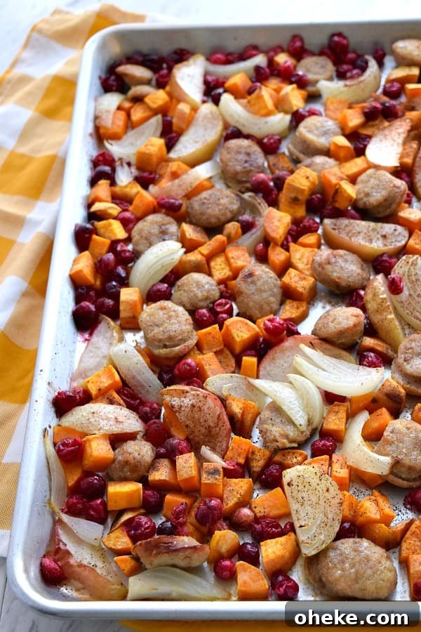 top view of tossed and cooked Close up of colorful uncooked Sheet Pan Cranberry Chicken Sausage