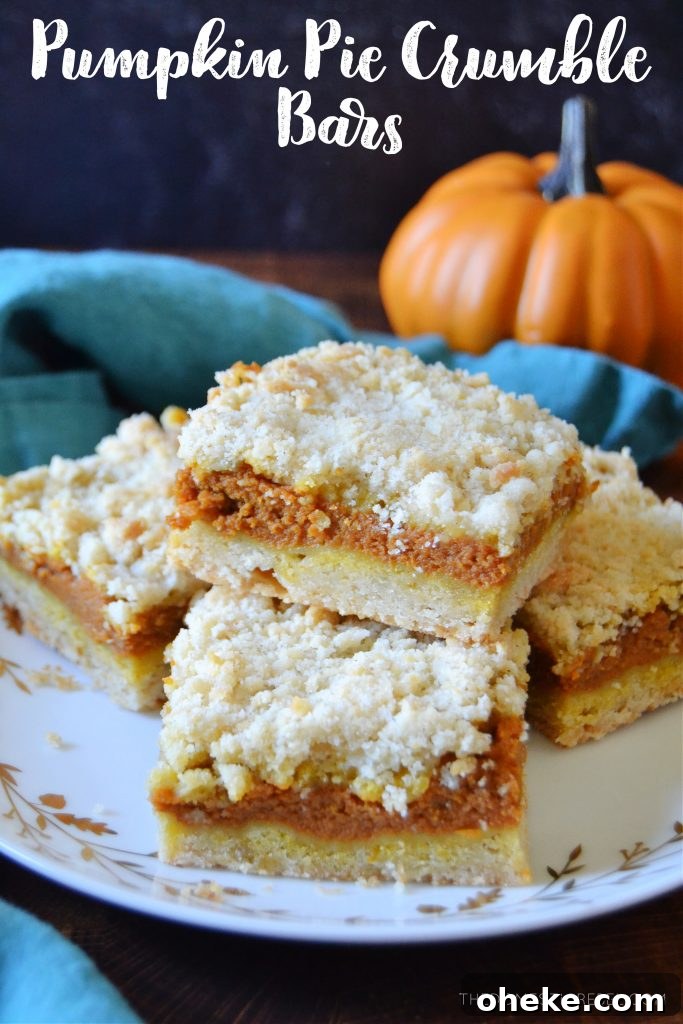 Pumpkin Pie Crumble Bars Recipe — Fall Dessert Bars 2 a plateful of pumpkin pie crumble bars on a white plate with a teal towel
