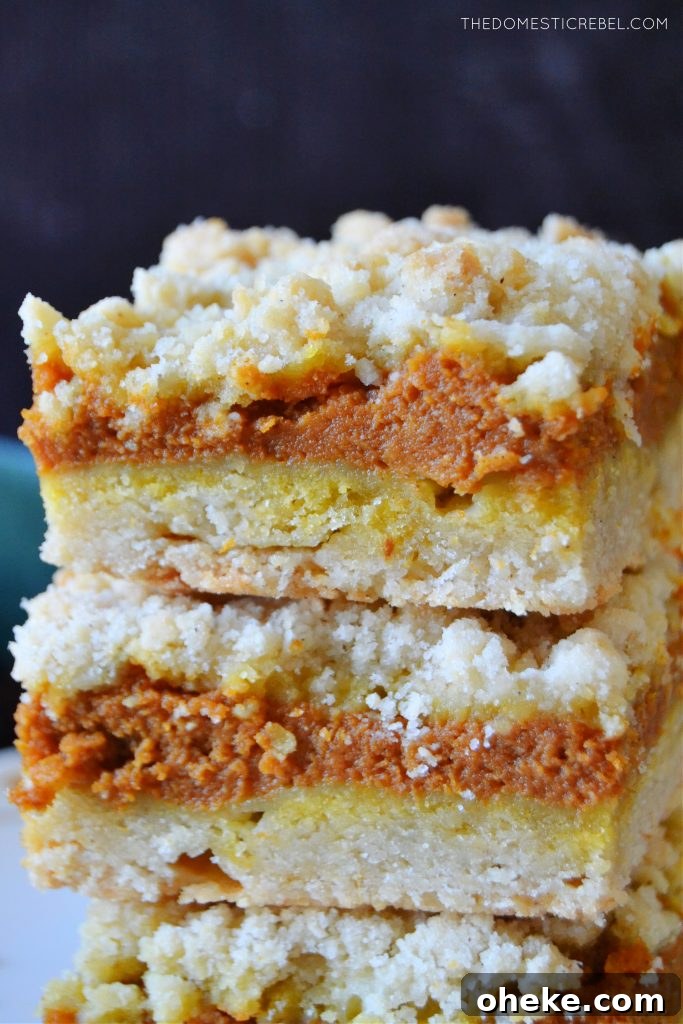 Pumpkin Pie Crumble Bars Recipe — Fall Dessert Bars 4 a closeup vertical stack of pumpkin pie crumble bars