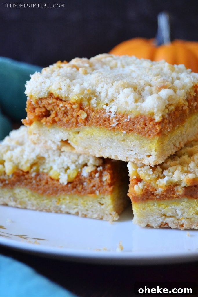 Pumpkin Pie Crumble Bars Recipe — Fall Dessert Bars 5 a closeup stack of pumpkin pie crumble bars