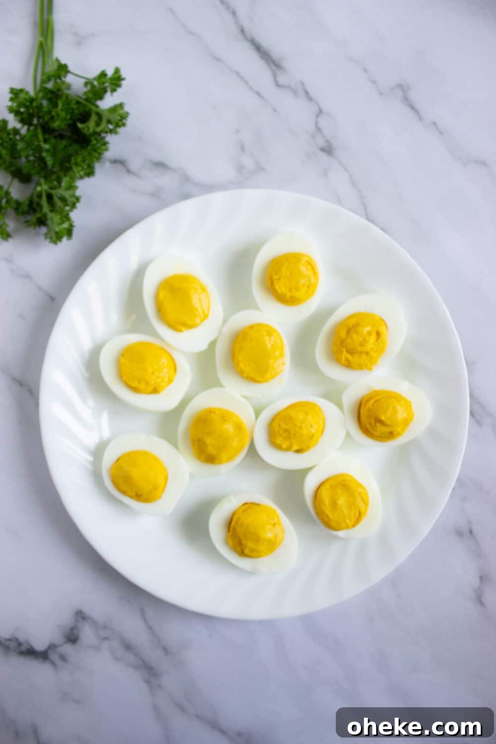 Pumpkin-Spiced Deviled Eggs for Low-Carb Fall Brunch 12 overhead view deviled egg ready for decorating