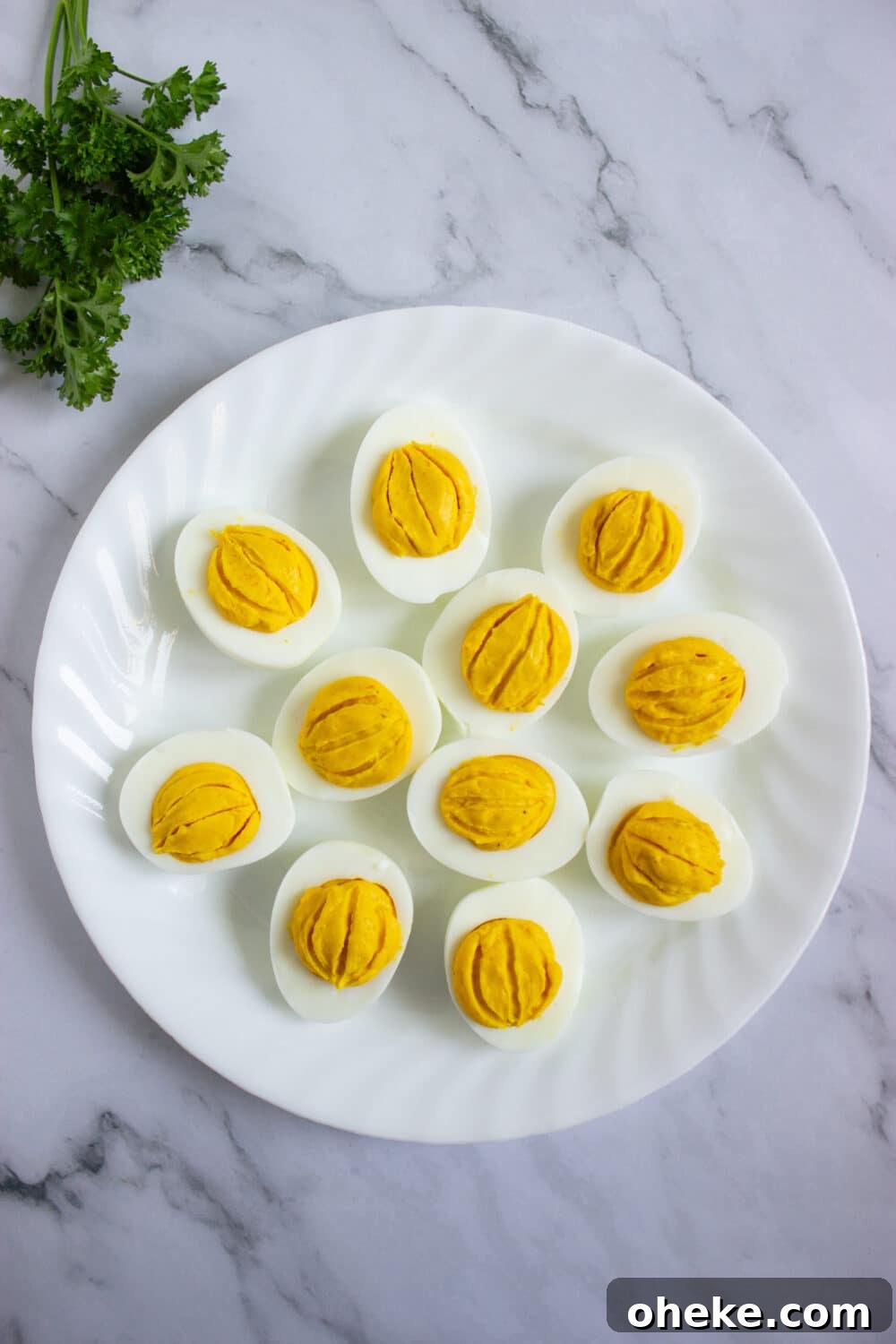 Pumpkin-Spiced Deviled Eggs for Low-Carb Fall Brunch 13 overhead view deviled eggs ready to garnish