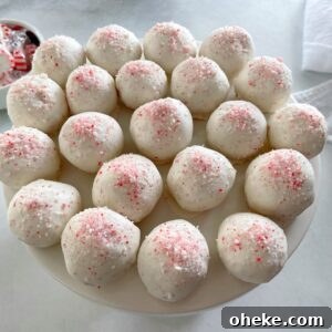 peppermint cake pops on a cake stand