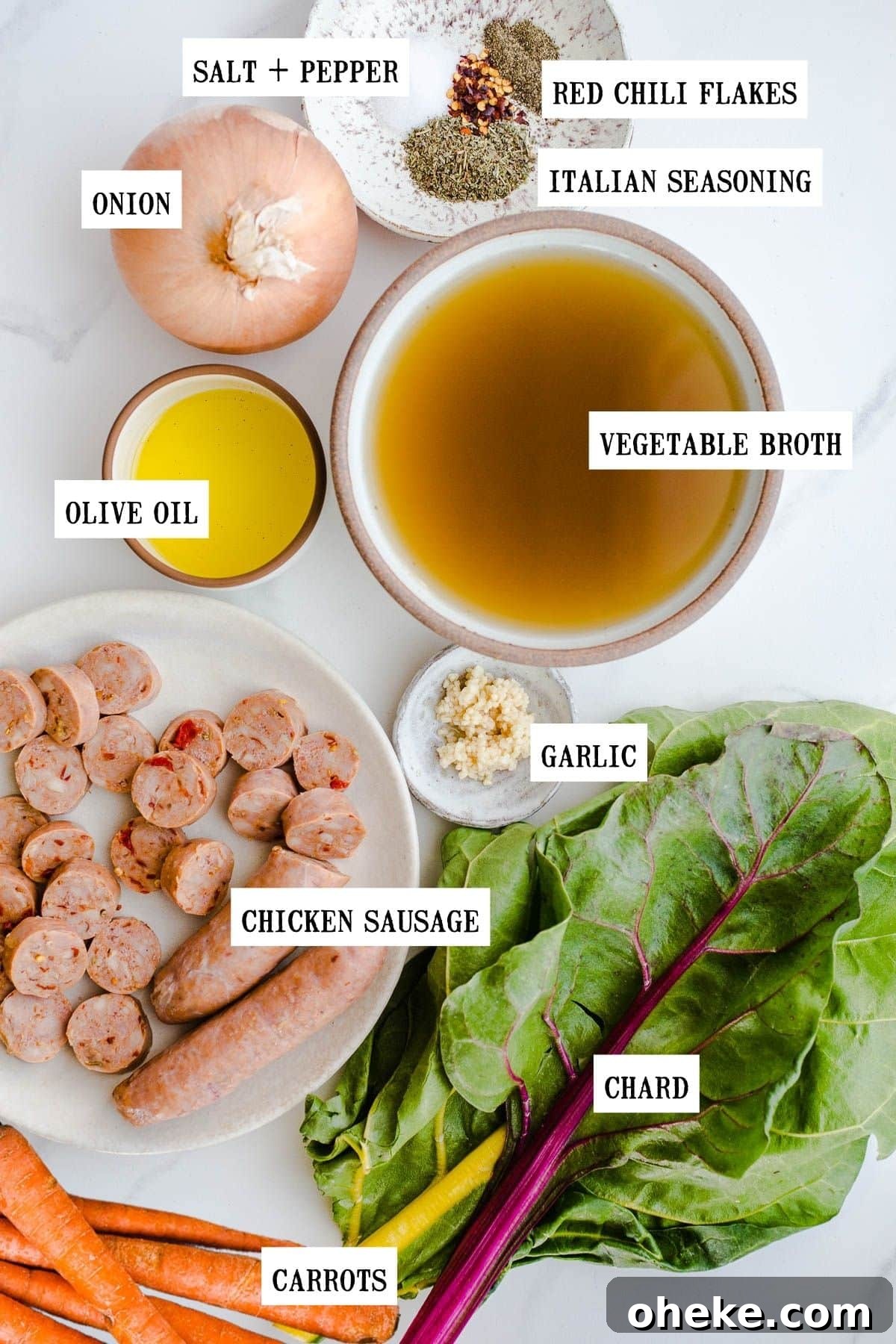 Ingredients to make squash soup on a marble surface.