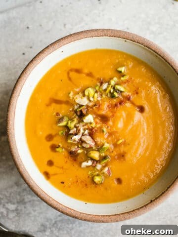 A rustic bowl filled with creamy sweet potato soup.