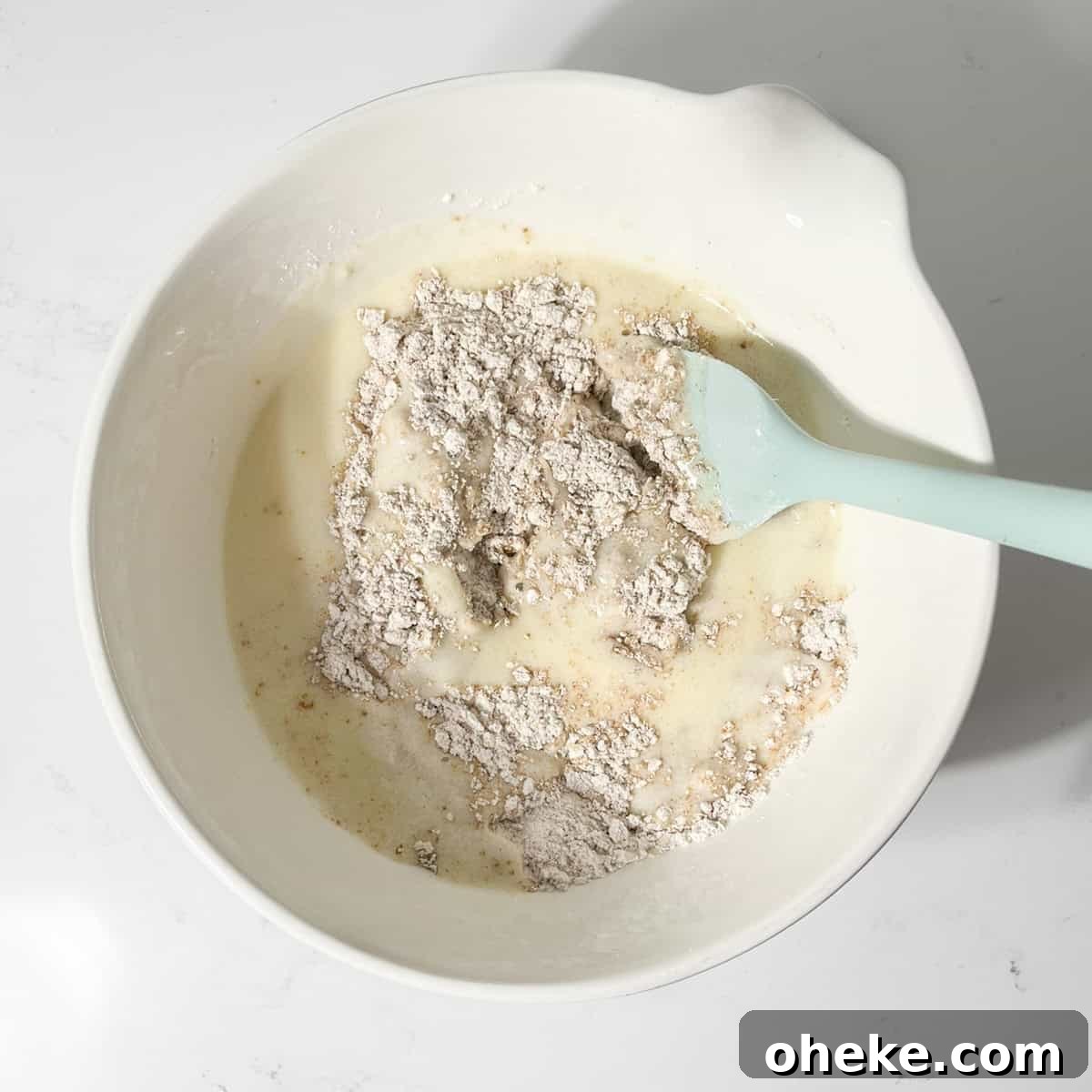 Moist Buttermilk Blueberry Muffins Recipe for Perfect Muffins 7 Stirring the liquids into the dry ingredients for the blueberry muffins.