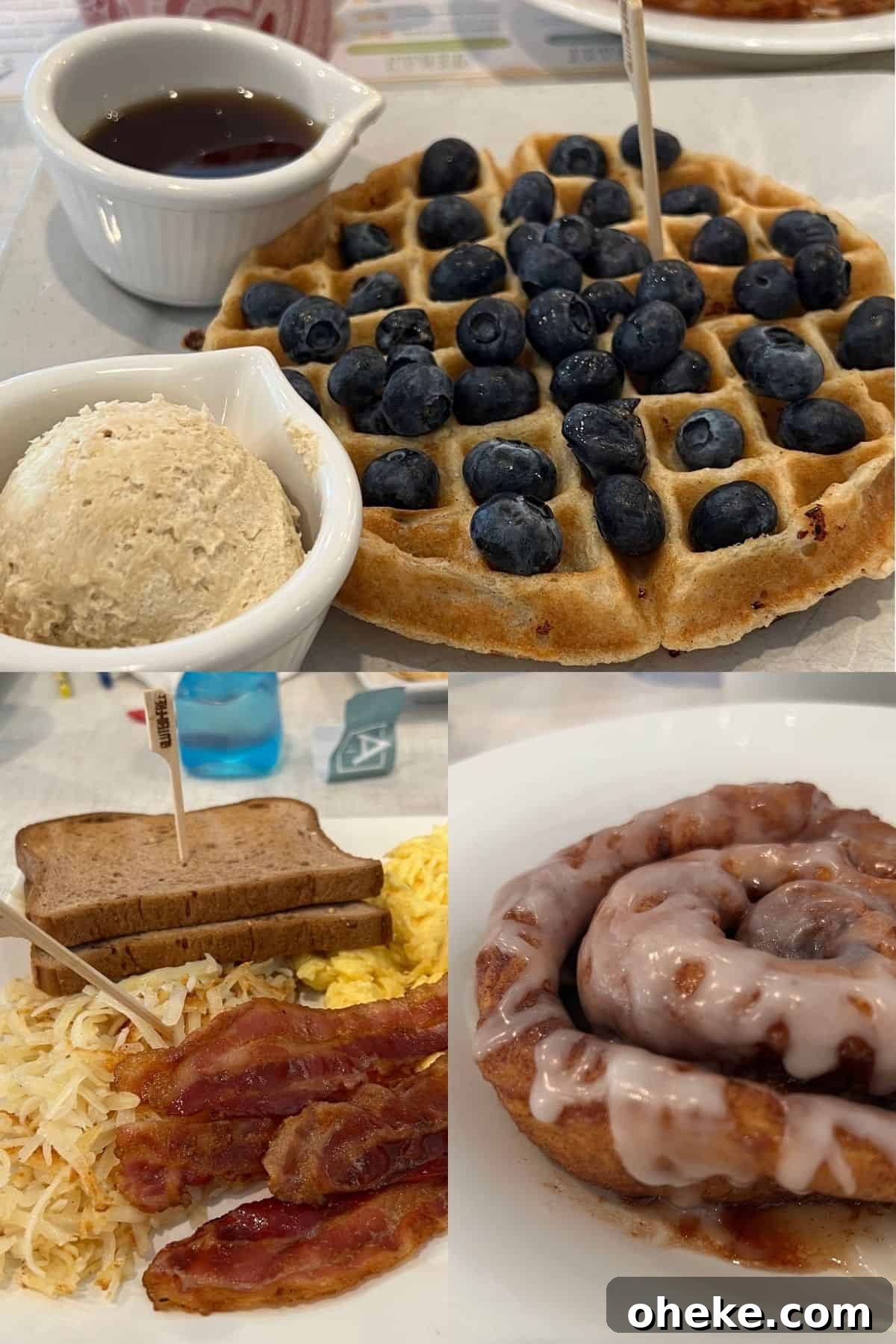 Belgian waffle with blueberries, toast, scrambled eggs, bacon, and a cinnamon roll. 