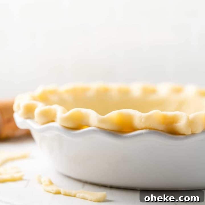 Gluten-free pie dough in white pie plate.