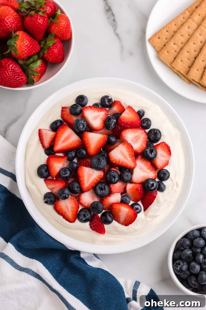 top-down view of the Patriotic Cheesecake Dip in a white bowl.