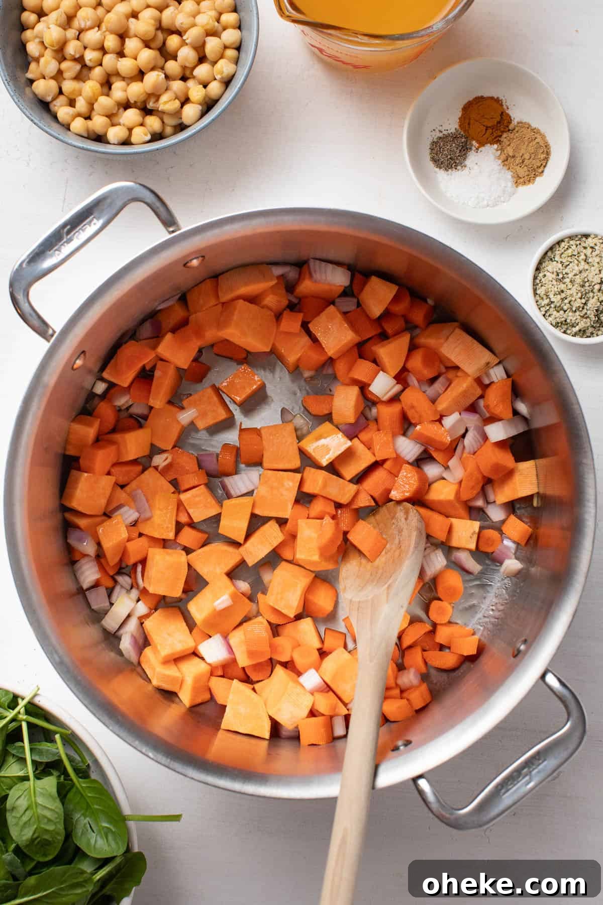 Turmeric Ginger Chickpea Stew to Reduce Inflammation 4 Cooking the carrots, sweet potatoes and shallots in a large pot.