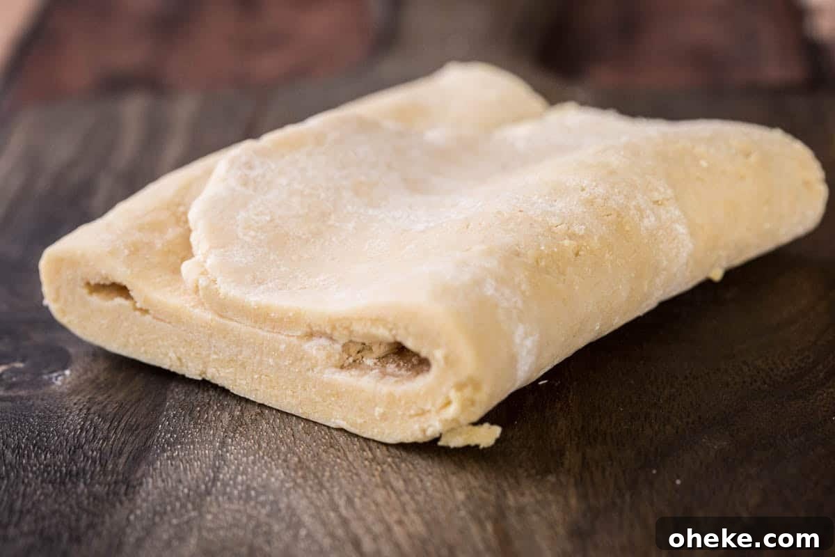 Quick Homemade Gluten-Free Rough Puff Pastry Recipe 13 Gluten-Free Puff Pastry dough folded on a table.