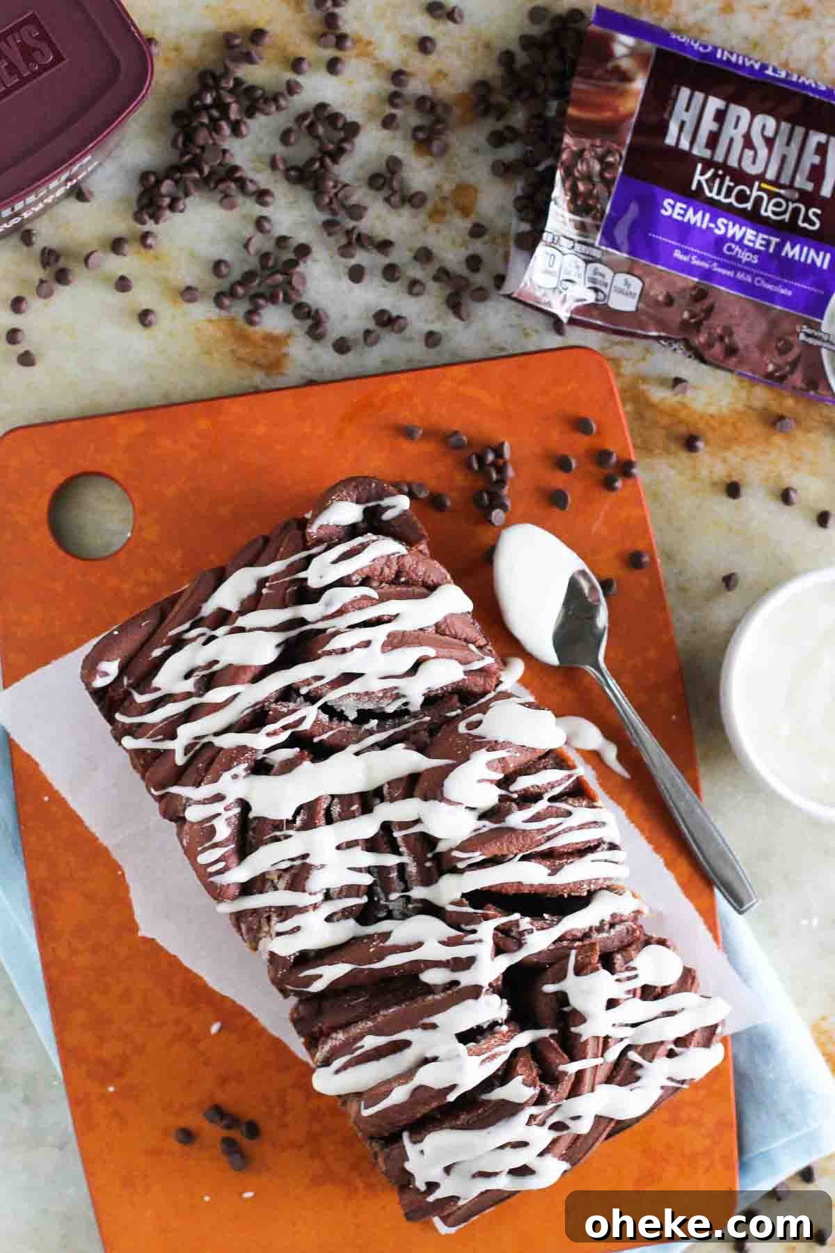 Decadent Chocolate Pull-Apart Bread Recipe 5 Chocolate Pull Apart Bread with mini chocolate chips on a cutting board.