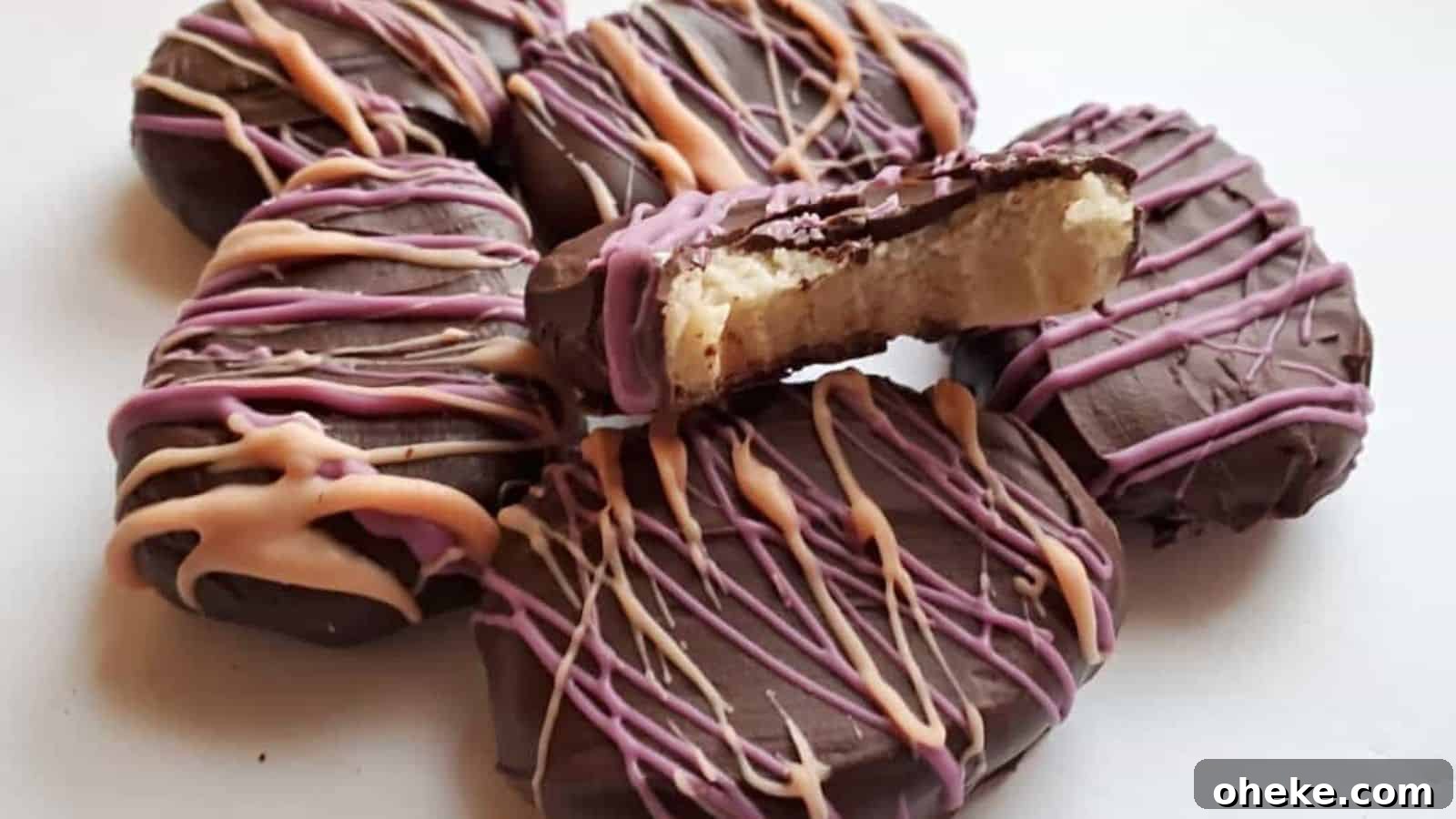 Image shows a cluster of easter egg truffles with one missing a bite and showing the cookie dough inside.