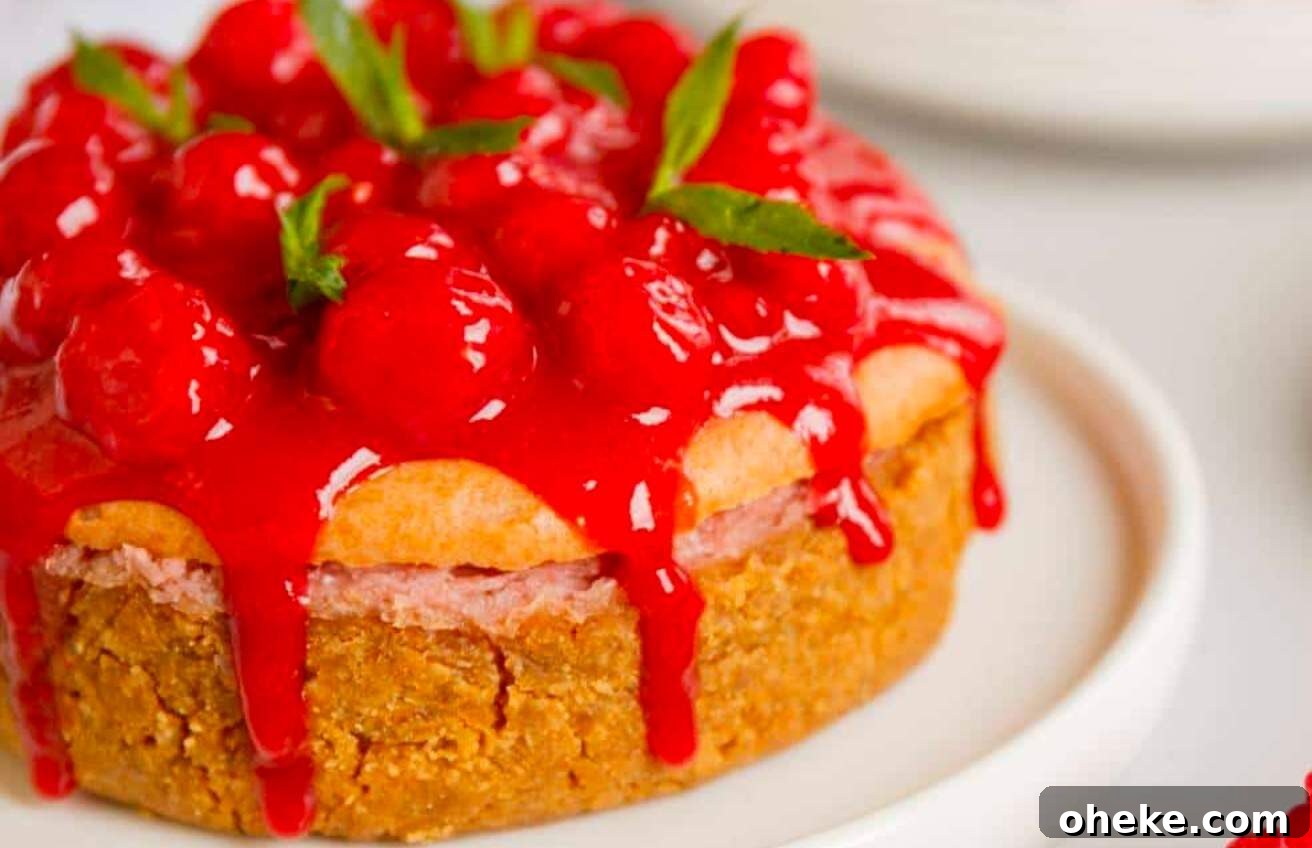 Raspberry lemon cheesecake topped with raspberry sauce.
