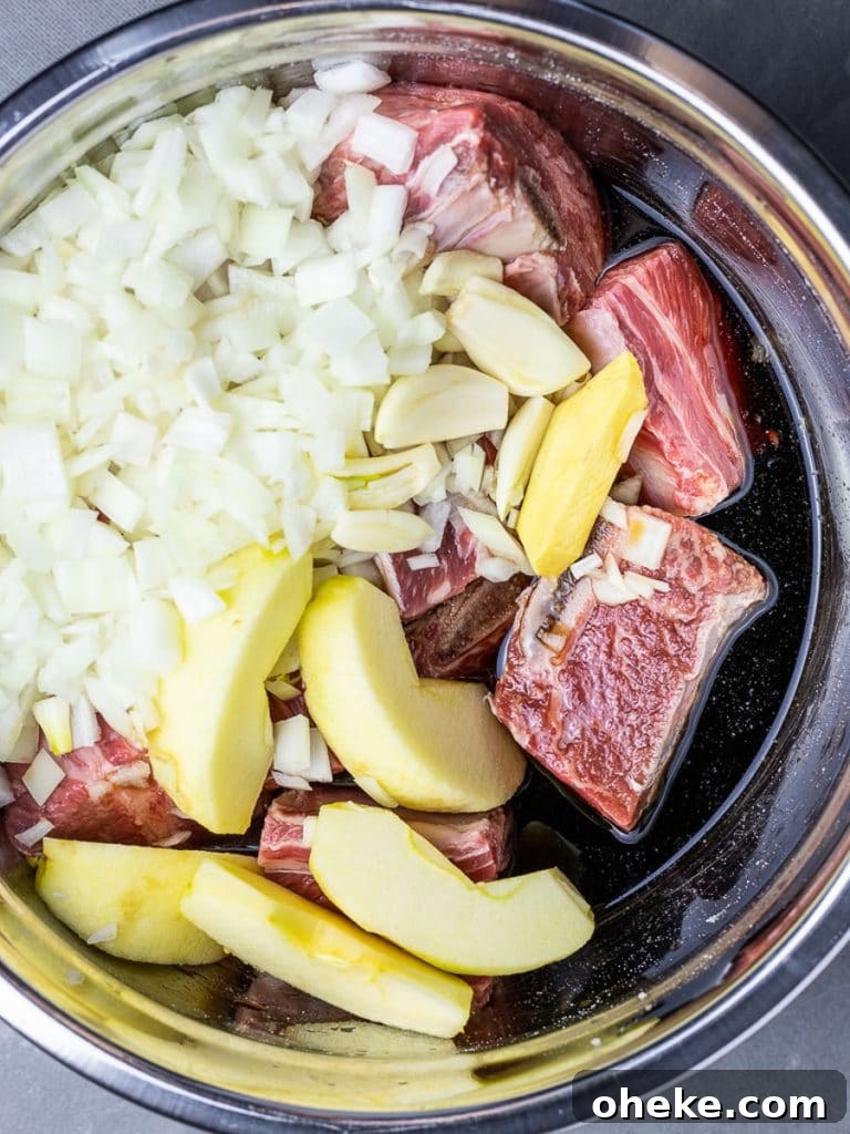 Korean short ribs in an instant pot with onions and garlic
