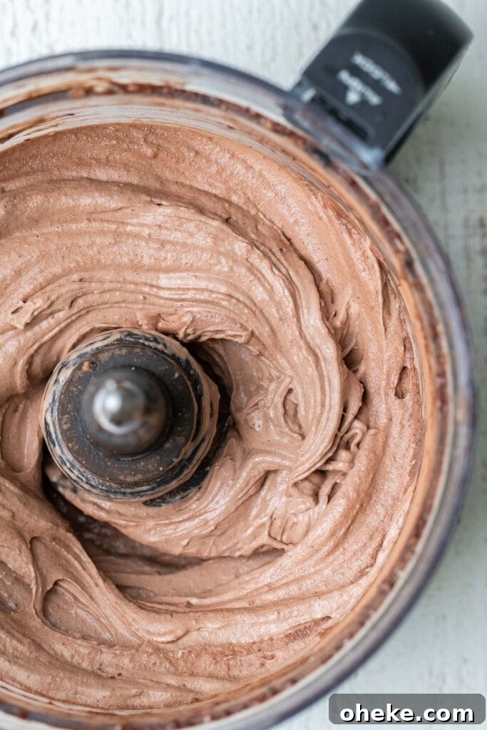 Thick Dreamy Chocolate Smoothie Bowl Recipe for Breakfast 6 A food processor shown with a thick chocolate smoothie.