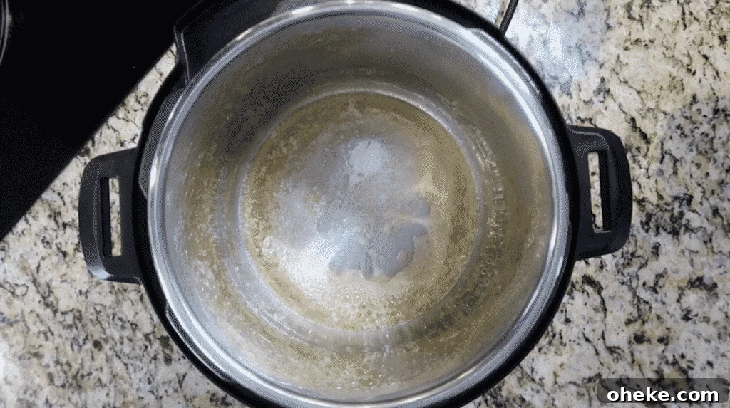 Melted butter and hot oil in pot