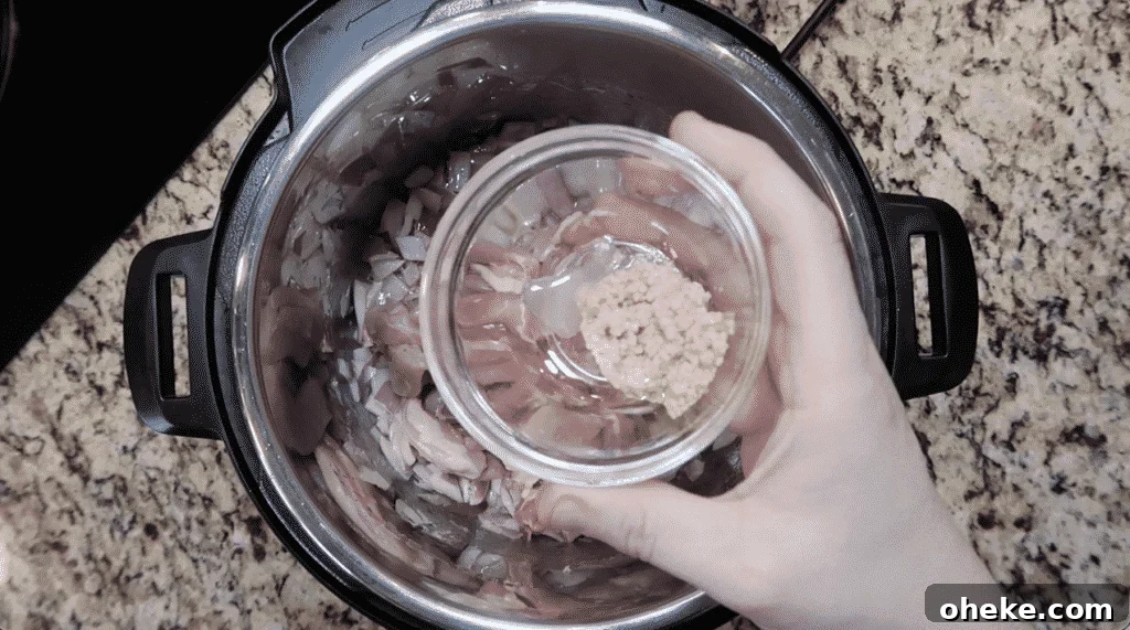 Adding garlic to pot