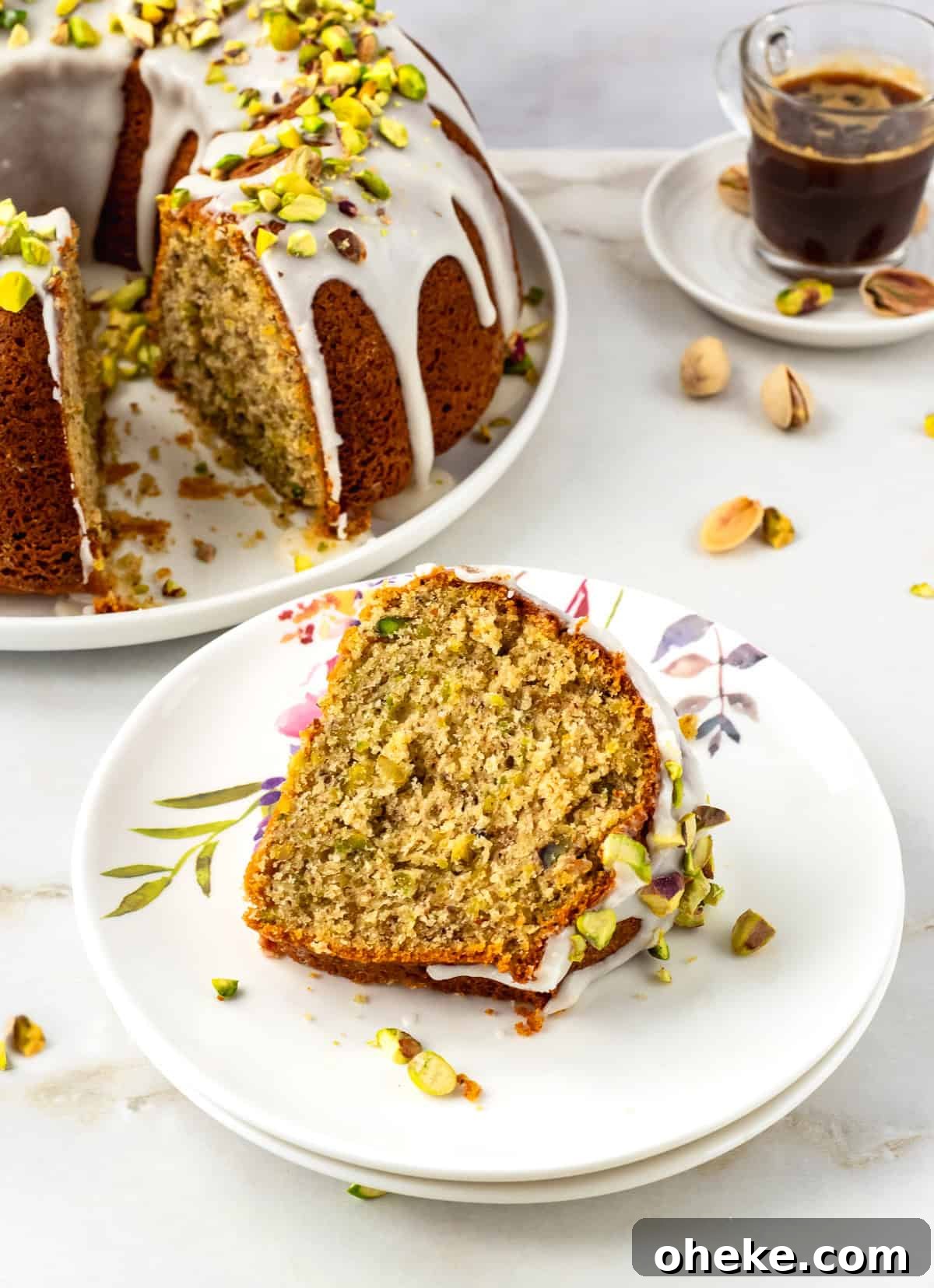 Slice of pistachio bundt cake on plate.