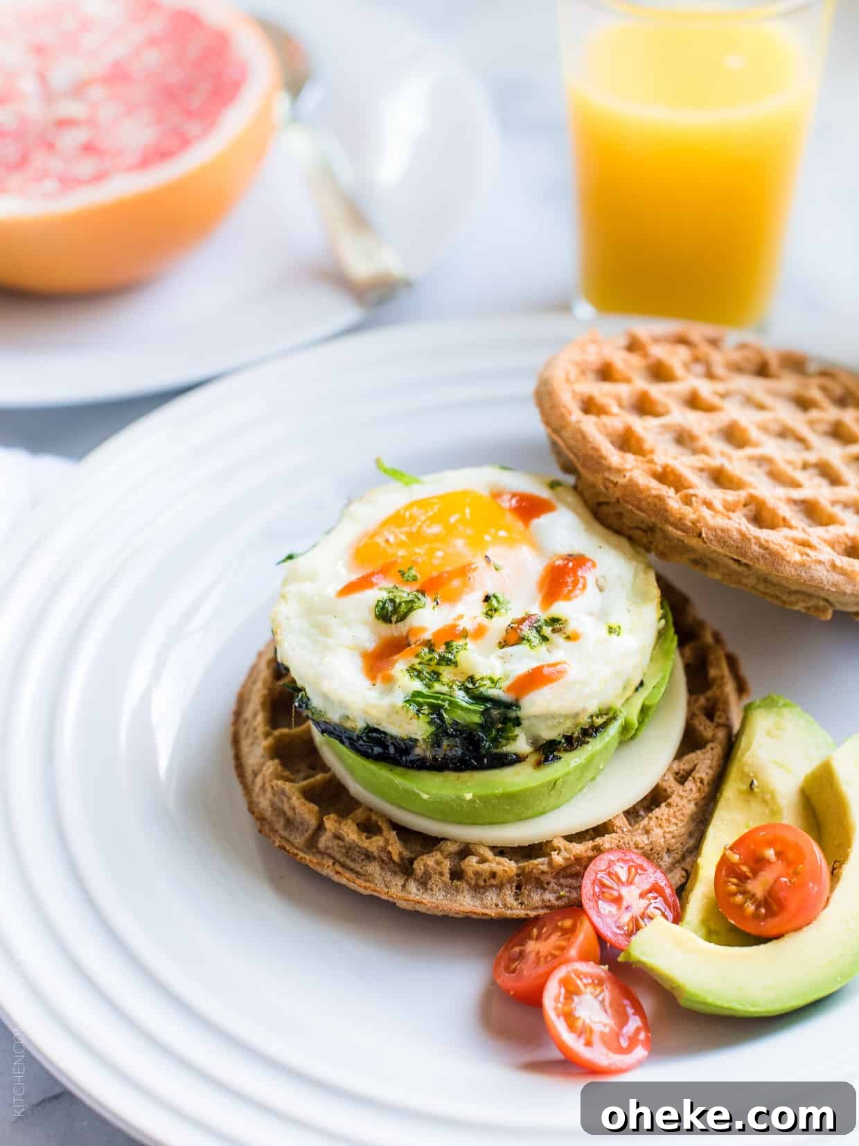 Waffle Breakfast Sandwich Ideas for Quick Morning Meals 4 A Waffle Breakfast Sandwich filled with a microwaved egg, avocado, and hot sauce.