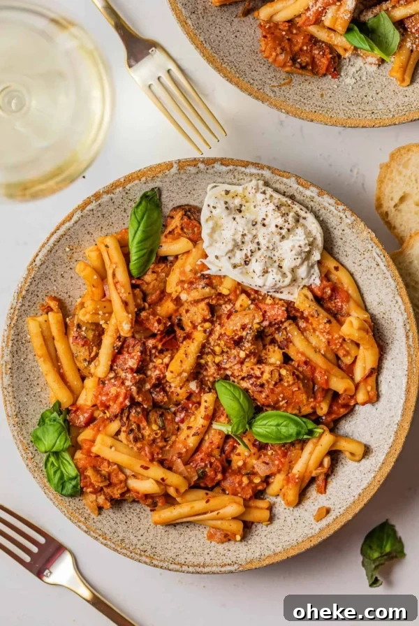Short Rib Bolognese Recipe: Slow-Simmered, Rich Italian Ragu 16 casarecce pasta in a bowl with burrata and fresh basil