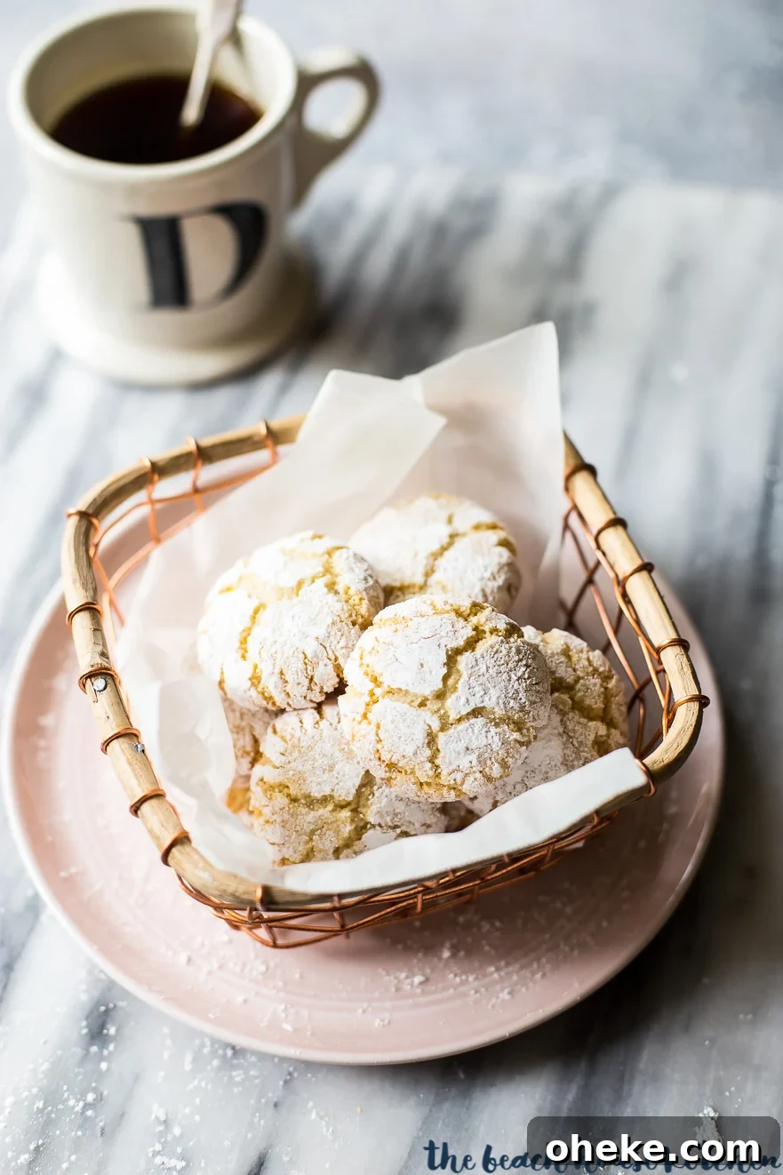 Classic Italian Amaretti Cookies Recipe — Crispy, Almond-Flavored Treats 2 Overhead photo of amaretti cookies in a wire basket