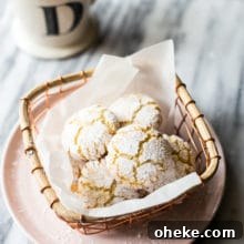 Classic Italian Amaretti Cookies Recipe — Crispy, Almond-Flavored Treats 8 Overhead photo of amaretti cookies in a wire basket