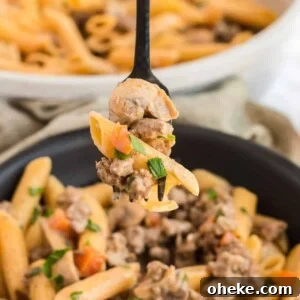 A forkful of ground beef stroganoff.