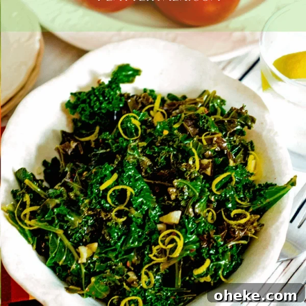 Bowl of steamed kale with lemon zest garnish.