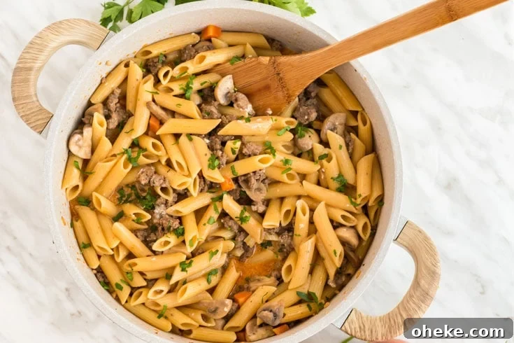 A bowl of food, with Hamburger and Pasta