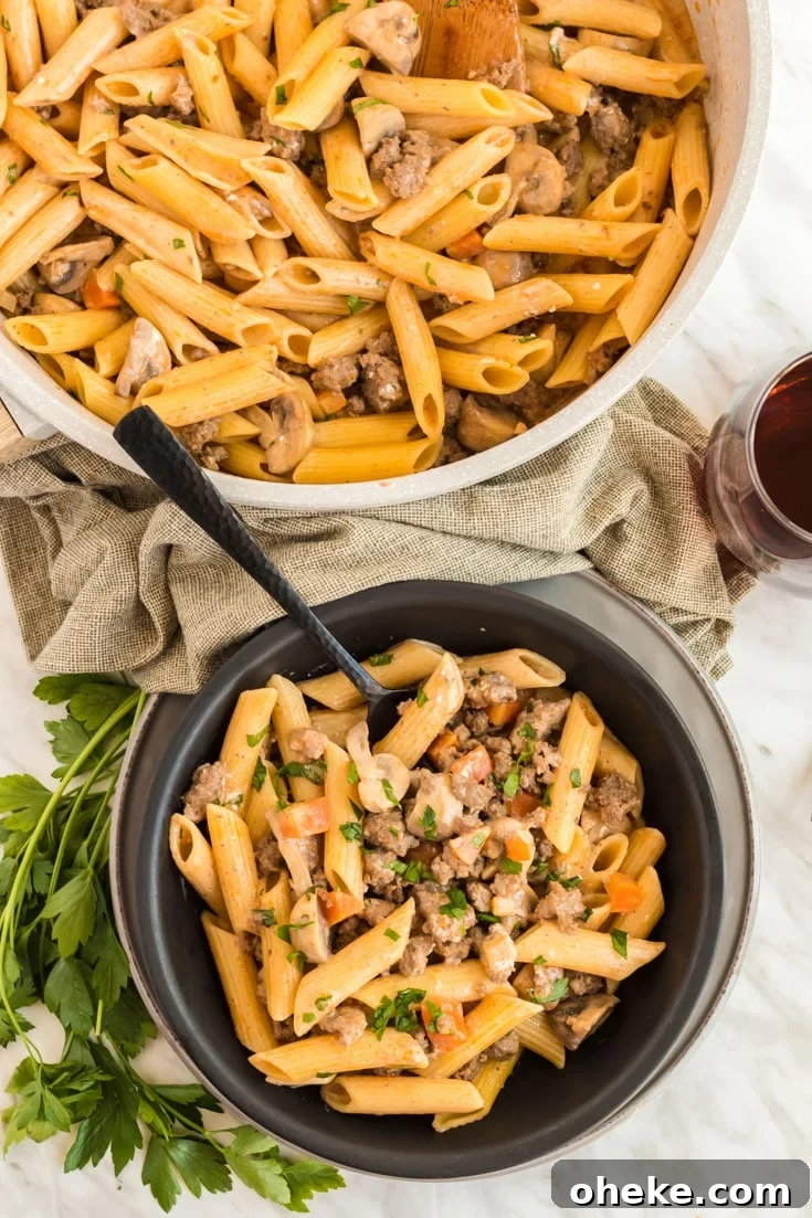 Skillet of beef and pasta and a filled serving bowl.