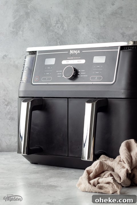 Air Fryer Buying Guide: What to Know Before You Buy 2 A Ninja Foodi Max Dual Zone air fryer with a napkin