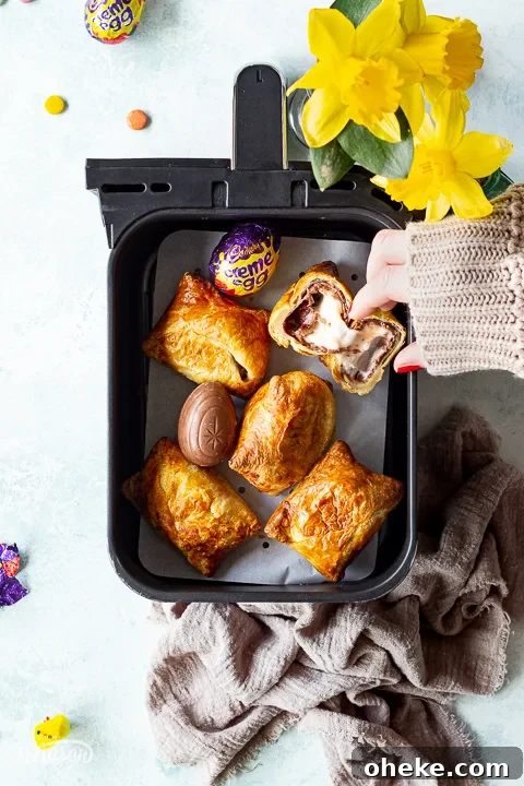 Air Fryer Buying Guide: What to Know Before You Buy 11 Someone taking an air fried Creme Egg croissant from an air fryer drawer