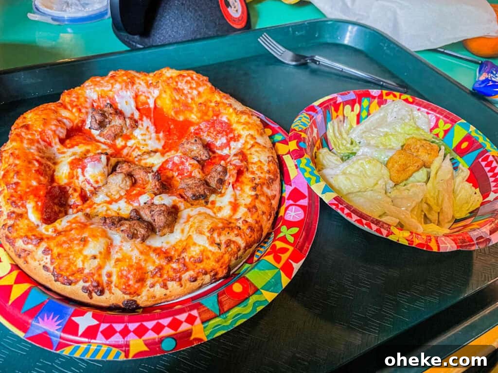 Pizzafari: Explore Unique Pizza Flavors and Restaurant Guide 8 sausage and pepperoni pizza with side Caesar salad.