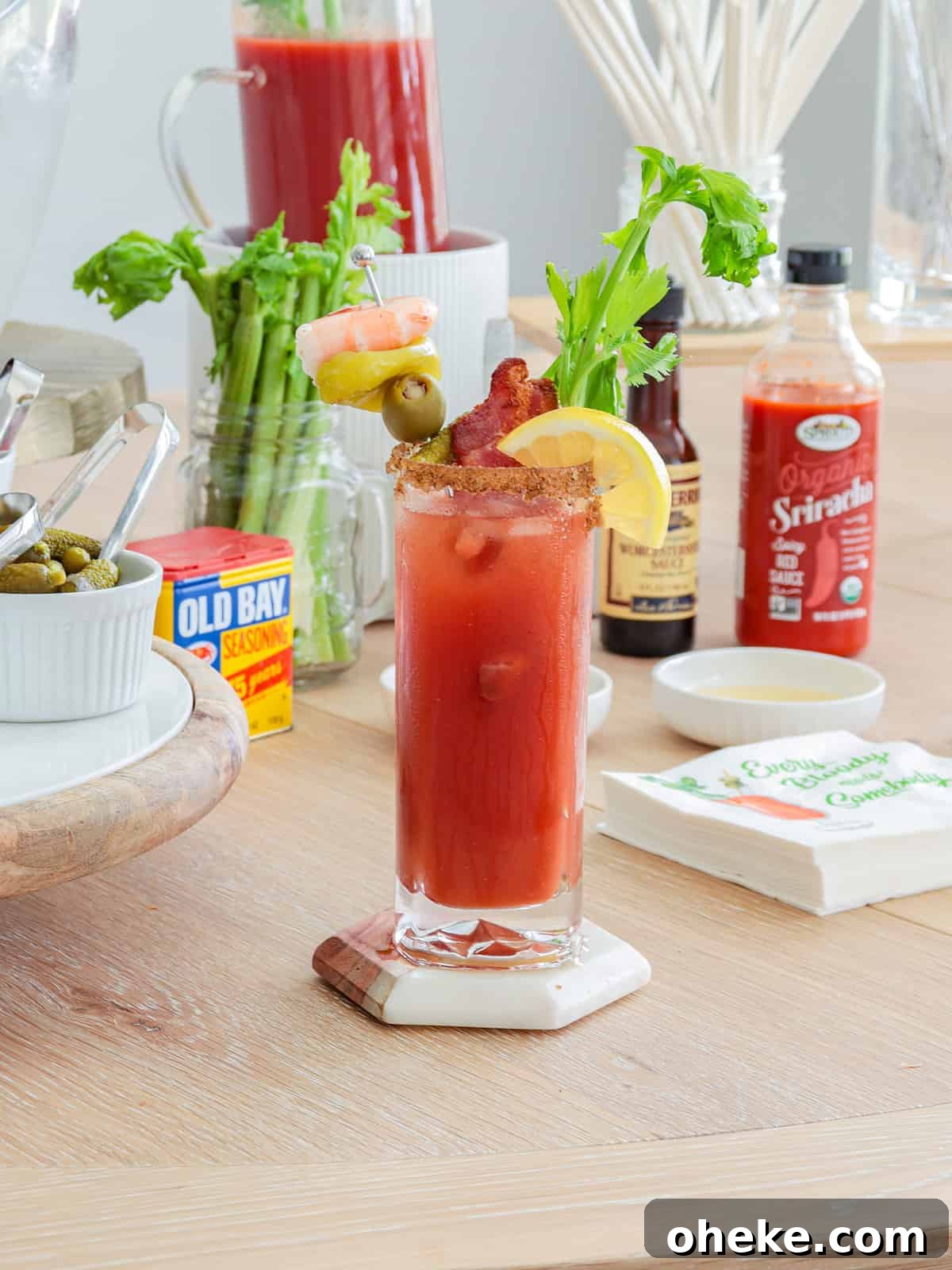Build a Bloody Mary Bar: DIY Cocktail Station Guide 6 Bloody mary with fancy garnish ontable.