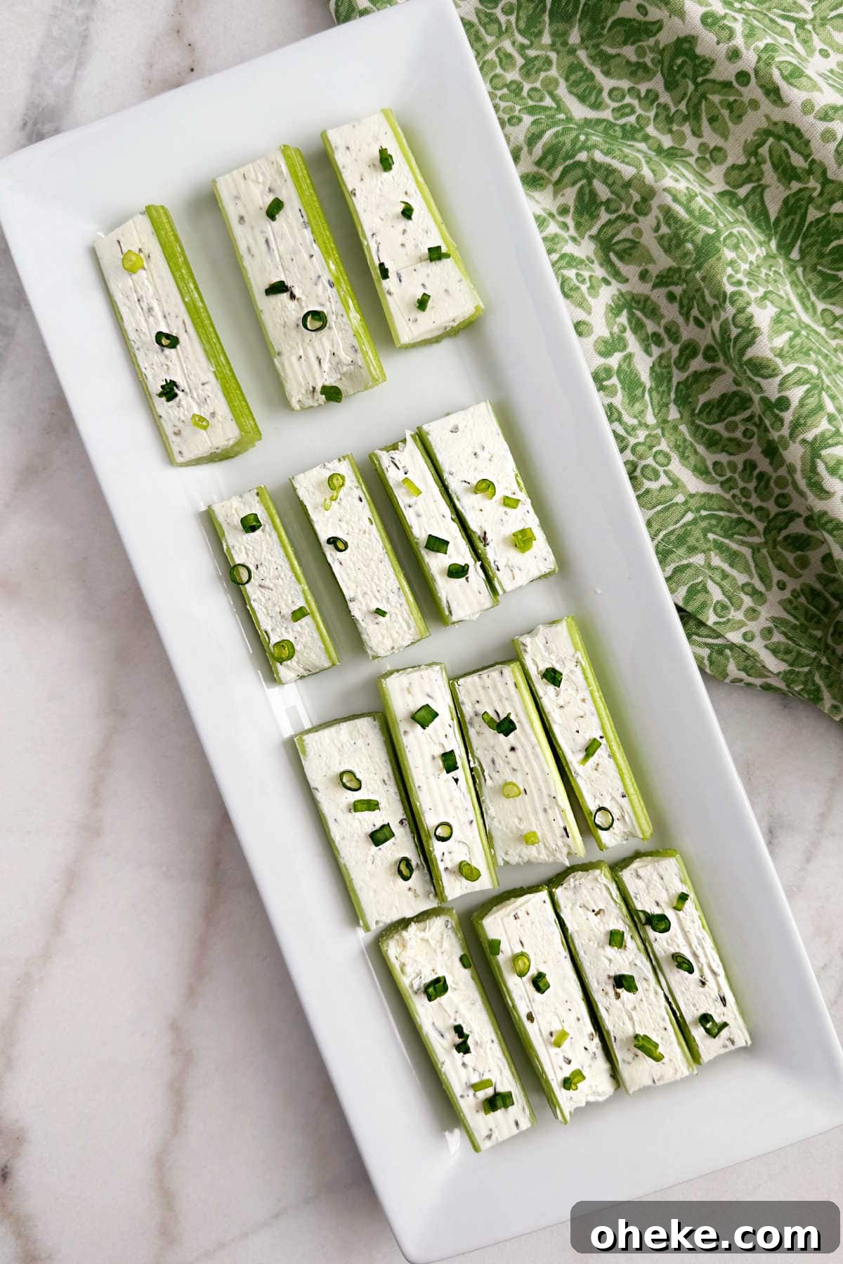 Mom’s Classic Stuffed Celery Recipe — Party Appetizer 2 celery stuffed with cream cheese and chives.