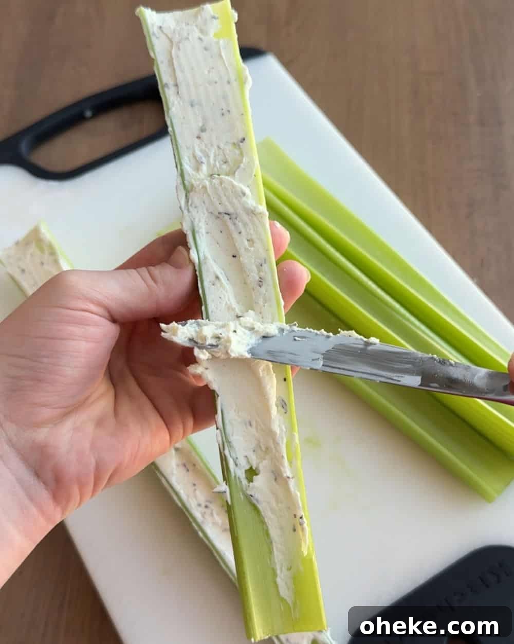 Mom’s Classic Stuffed Celery Recipe — Party Appetizer 6 spread filling into celery.