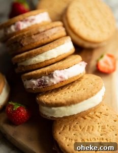 Cheesecake sandwiches 6 cheesecake sandwiches spread on wooden board with strawberries
