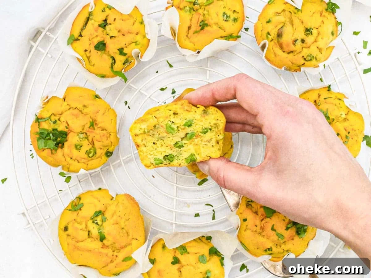 Savory Chickpea Frittata Muffins for Meal Prep 4 Chickpea Muffins and hand holding a muffin cut in half