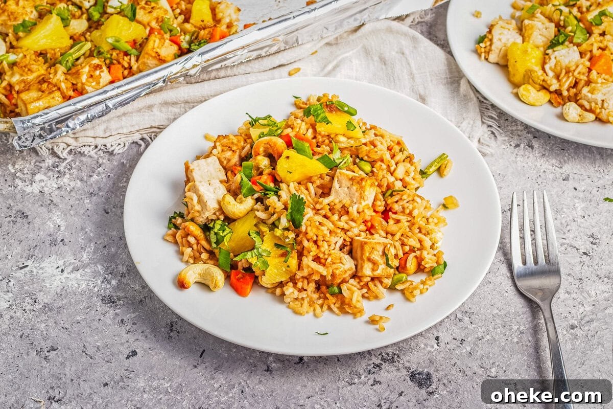 Wok-Seared Pineapple Fried Rice with Shrimp and Cashews 13 An image of pineapple fried rice on a plate.